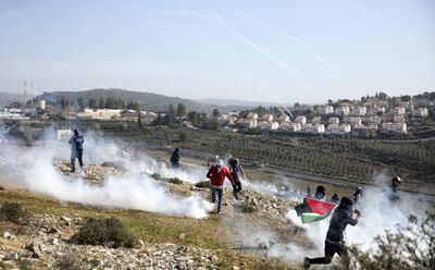 Palestinian demonstrators clash with Israeli forces during a demonstration held in Nabi Saleh by the Jewish West Bank settlement of Nabi Salah in support of imprisoned Ahed Tamimi and others on January 13,2018. (Photo by Heidi Levine for The National).