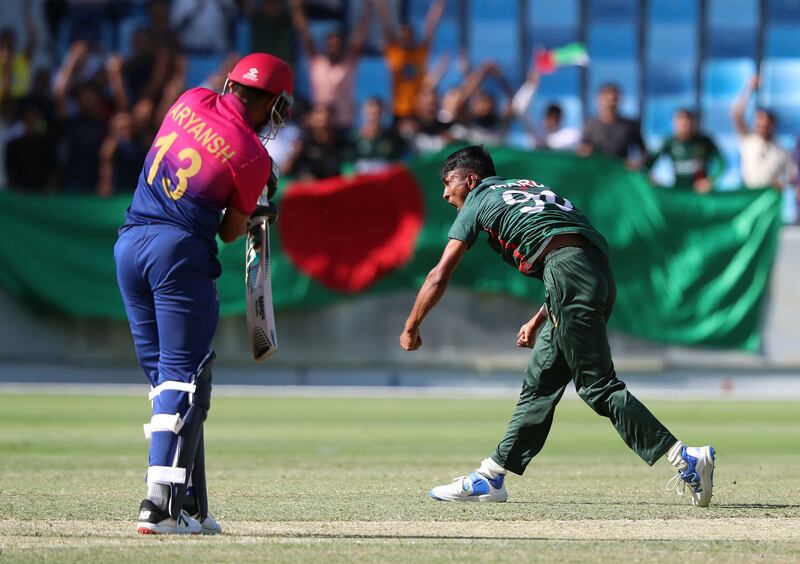 Bangladesh's Maruf Mridha takes the wicket of the UAE's Aryansh Sharma.