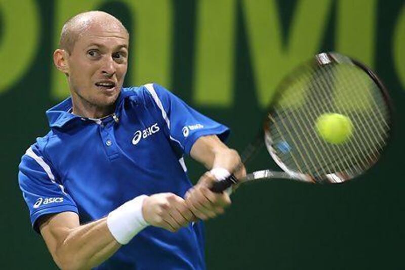 Russia's Nikolay Davydenko returns the ball to Victor Hanescu of Romania during the first day of the 2013 ATP Qatar Open in Doha on December 31, 2012. AFP PHOTO / AL-WATAN DOHA / KARIM JAAFAR == QATAR OUT ==

 *** Local Caption *** 178224-01-08.jpg