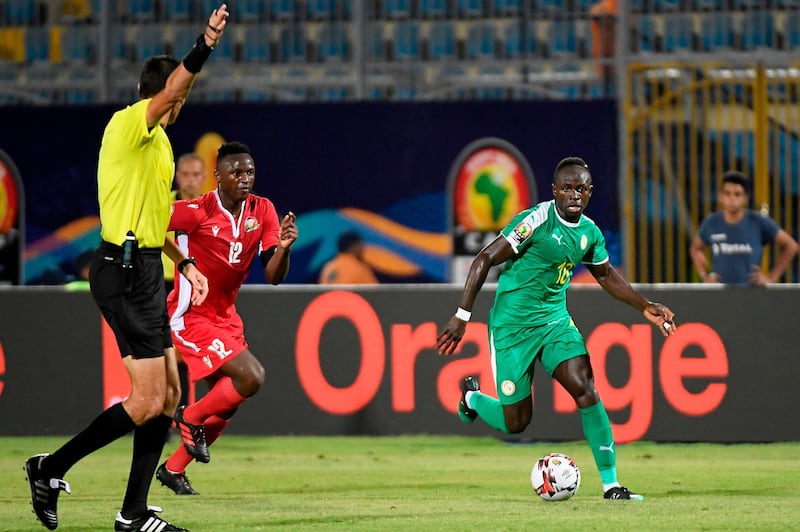 Kenya midfielder Victor Wanyama, left, fights for the ball with Senegal forward Sadio Mane during the 2019 Africa Cup of Nations Group C match at the 30 June Stadium in Cairo. Senegal won the match 3-0. AFP