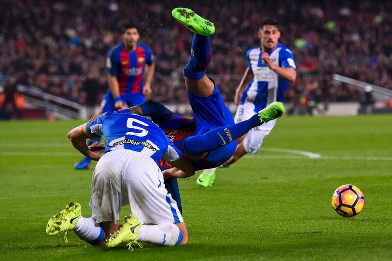 Leganes’ Argentine defender Martin Mantovani, left, vies with Barcelona’s Brazilian forward Neymar during the Spanish league football Primera Liga match at Camp Nou in Barcelona on February 19, 2017. Barcelona went on to win the match 2-1. Josep Lago / AFP