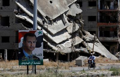 A poster of Syrian President Bashar Al Assad is displayed in Homs. Reuters