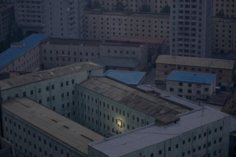 A picture of North Korea’s founder Kim Il-sung decorates a building in the capital Pyongyang early on October 5, 2011. Damir Sagolj / Reuters