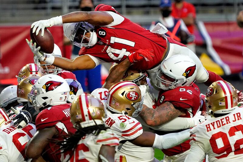 Arizona Cardinals running back Kenyan Drake (41) dives over the line for a touchdown against the San Francisco 49ers during the second half of an NFL football game in Glendale, Arizona. AP Photo