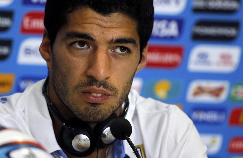 Many have given Luis Suarez unqualified support, fuelling his unedifying, unjustified persecution complex, writes our columnist. Carlos Barria / Reuters