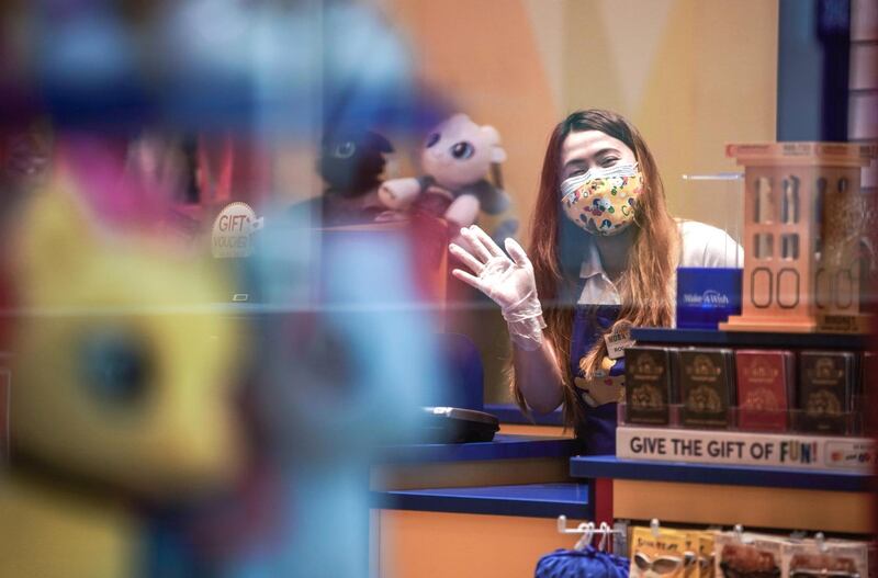 Abu Dhabi, United Arab Emirates, May 9, 2020.  Yas Mall, Abu Dhabi will be open from noon to 9pm. Supermarkets and pharmacies will be open from 9am to midnight.  A cashier is happy to be back at work during the Coronavirus epidemic.
Victor Besa/The National
Section:  NA
Reporter: