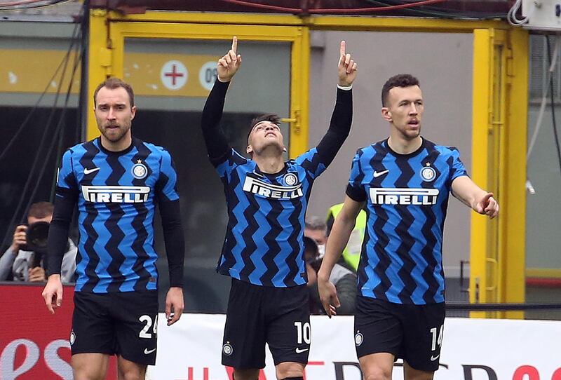 Inter Milan's Lautaro Martinez, centre, celebrates after scoring his team's first goal during their 3-0 Serie A win over AC Milan at the San Siro on February 21. EPA