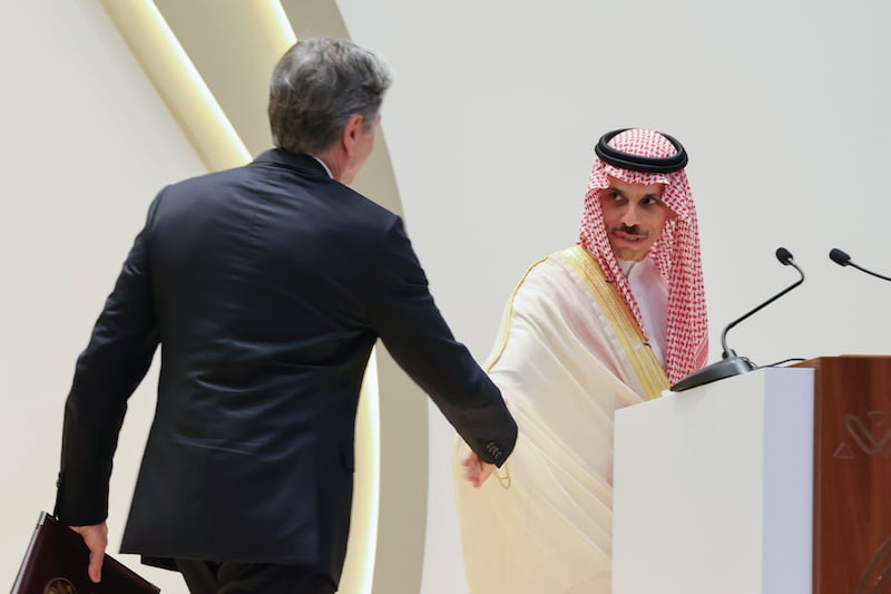 Mr Blinken shakes hands with Saudi Foreign Minister Prince Faisal bin Farhan during a news conference in Riyadh. AP 