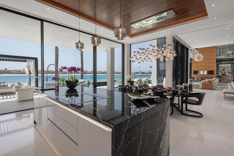 The formal kitchen and dining area. Courtesy Luxhabitat Sotheby's International Realty