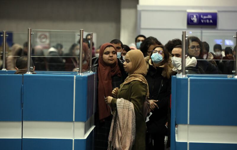 Tunisians who took off from Bucharest after fleeing to Romania following Russia's invasion arrive in Tunis. EPA