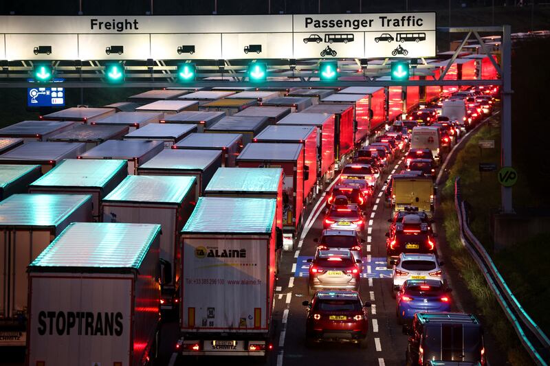 Cars and trucks queue at the UK entrance of the Eurotunnel on December 17 before increased restrictions for travel to France from Britain. Reuters