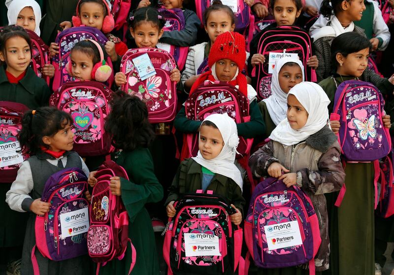 Girls get school bags provided by a local aid group, Mona Relief Yemen, at a public school in Sana'a, Yemen. Mona Relief Yemen has distributed school bags to encourage girls to keep attending classes as the number of out-of-school children is estimated more than two million, compared to 1.6 million before the ongoing war escalated in Yemen in 2015.  EPA