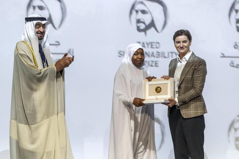 ABU DHABI, UNITED ARAB EMIRATES. 13 JANUARY 2020. The Zayed Sustainability Awards held at ADNEC as part of Abu Dhabi Sustainability Week. H.E. Sheikh Mohammed bin Zayed Al Nahyan, Crown Prince of Abu Dhabi and Deputy Supreme Commander of the United Arab Emirates Armed Forces awards Global High Schools Winner: Sub Sahara Africa, Hakimi Aliyu Day Secondary School, Nigeria with the Prime Minister of Serbia Ana Brnabić. (Photo: Antonie Robertson/The National) Journalist: Kelly Clarker. Section: National.

