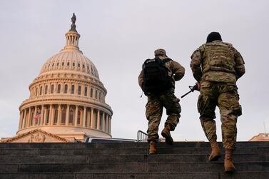 National Guard members patrol the Capitol building in Washington. Reuters