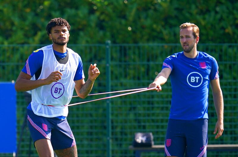 England's Tyrone Mings and Harry Kane during a training session at Hotspur Way. PA