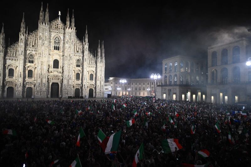 Fans celebrate in Milan's Piazza del Duomo in Milan after Italy beat England 3-2 on penalties to win the Euro 2020 final  on Sunday,  July 11.