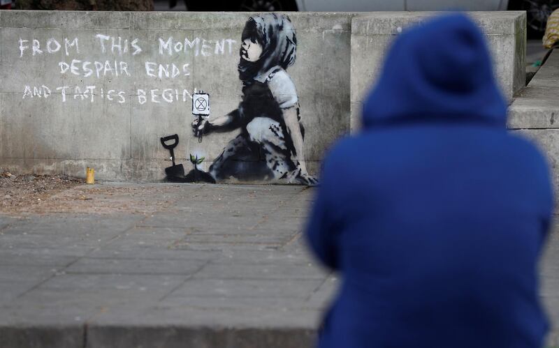 A graffiti believed to have been created by street artist Banksy is seen at Marble Arch. Reuters