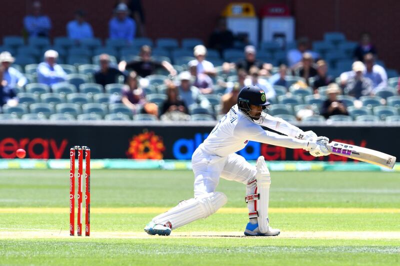 India's Wriddhiman Saha tips the ball to be caught behind from a ball by Australia's paceman Mitchell Starc on day two of the first cricket Test match between Australia and India in Adelaide on December 18, 2020. (Photo by William WEST / AFP) / --IMAGE RESTRICTED TO EDITORIAL USE - STRICTLY NO COMMERCIAL USE--