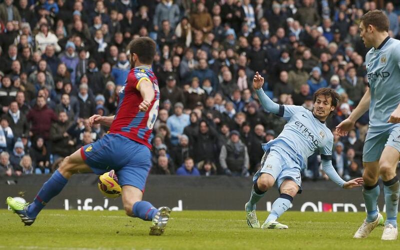 Manchester City's David Silva, second right, shoots to score against Crystal Palace during their English Premier League match at the Etihad Stadium in Manchester, England, on December 20, 2014. Phil Noble / Reuters