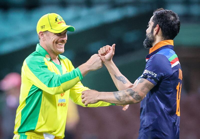 Australia's captain Aaron Finch with India's captain Virat Kohli after victory in the first ODI in Sydney. AFP