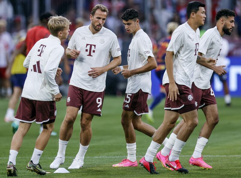 Harry Kane warms up with his Bayern teammates before the German Super Cup. EPA