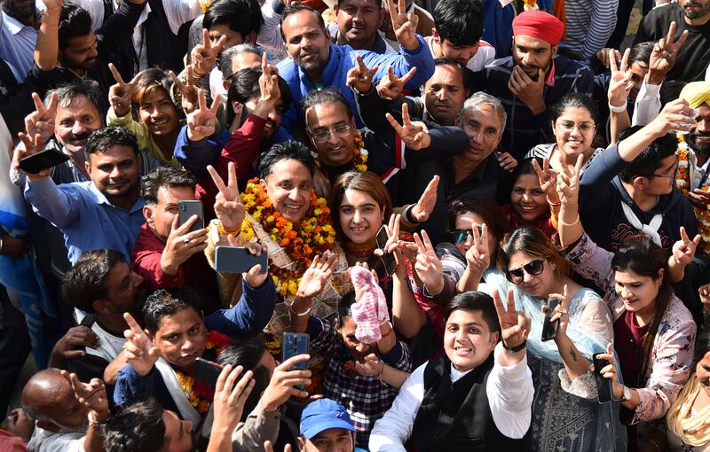 Ajay Gupta, from the Aam Aadmi Party, celebrates with supporters in Amritsar. AP Photo