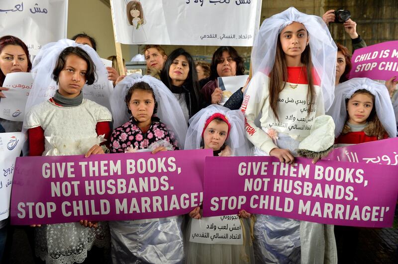 Young Lebanese girls carry placards as they participate in a march against child marriage in Beirut, Lebanon. Reports state hundreds marched in Beirut urging lawmakers to prepare legislation banning marriage of children below the age of 18.  EPA