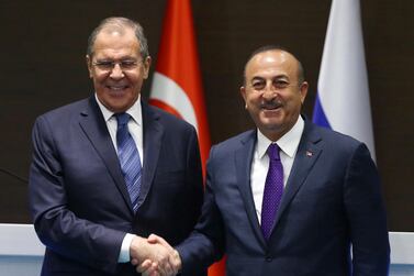 Turkey's Foreign Minister Mevlut Cavusoglu, right, and his Russian counterpart Sergei Lavrov shake hands after a news conference in the Mediterranean coastal city of Antalya, Turkey, Friday, March 29, 2019. AP