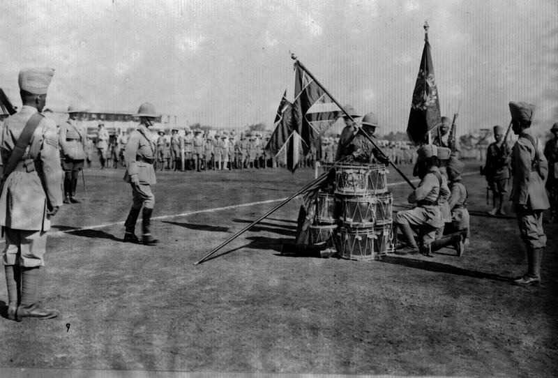 March 1921:  The Duke of Connaught (1850 - 1942) presenting colours at Poona to the 110th Madras.  (Photo by Topical Press Agency/Getty Images)