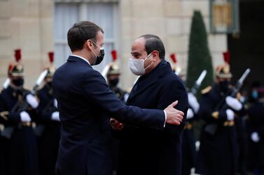 French President Emmanuel Macron welcomes Egyptian President Abdel Fattah El Sisi at the Elysee Palace on December 7, 2020. Reuters