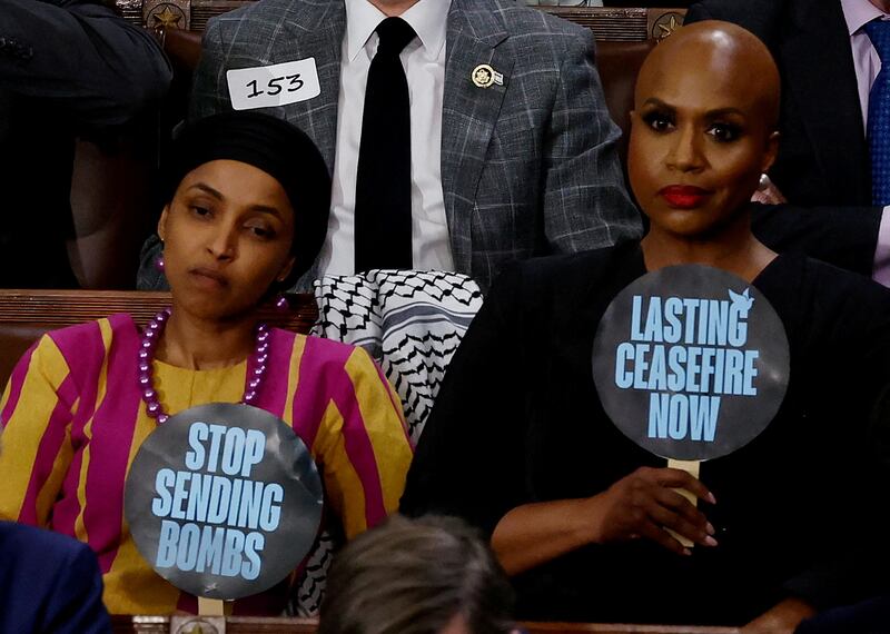 Democratic members of the House of Representatives Ilhan Omar, left, and Ayanna Pressley show their opposition to the US policy on Gaza. Reuters