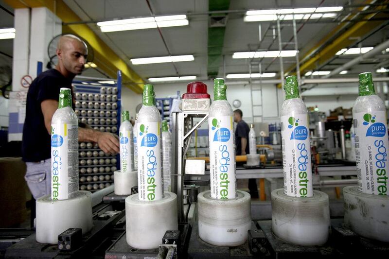 An employee packages carbon dioxide (CO2) cylinders at the SodaStream factory in Mishor Adumim, near Jerusalem, Israel. Ariel Jerozolimski / Bloomberg