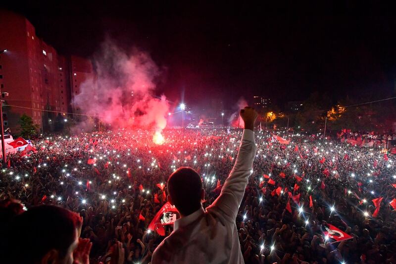 Ekrem Imamoglu, the candidate of the secular opposition Republican People's Party, CHP, waves to supporters at a celebratory rally in Istanbul.  AP