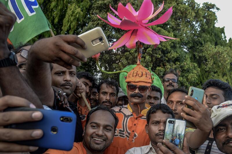 BJP supporters take a selfie at the public rally at Brigade ground. Getty Images