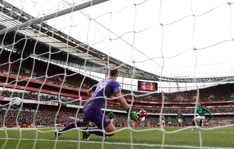 Glenn Murray scores the penalty for Brighton that ends Arsenal's top four hopes. Reuters