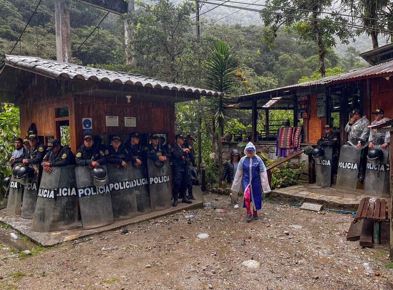 Riot police guard the entrance to a trail leading to Machu Picchu in Peru, amid protests by locals against the privatisation of rail links to the site. AFP