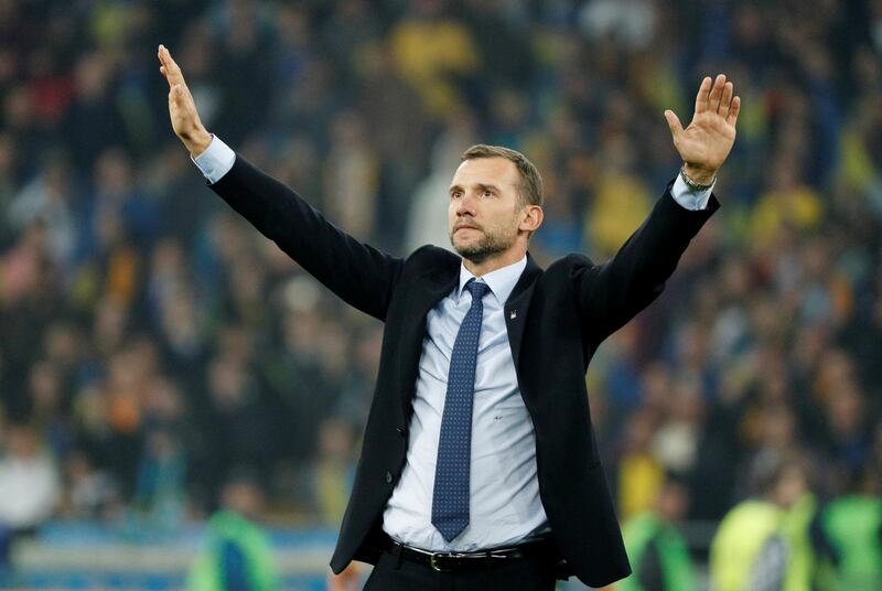 Ukraine coach Andriy Shevchenko celebrates at the end of the match. Reuters