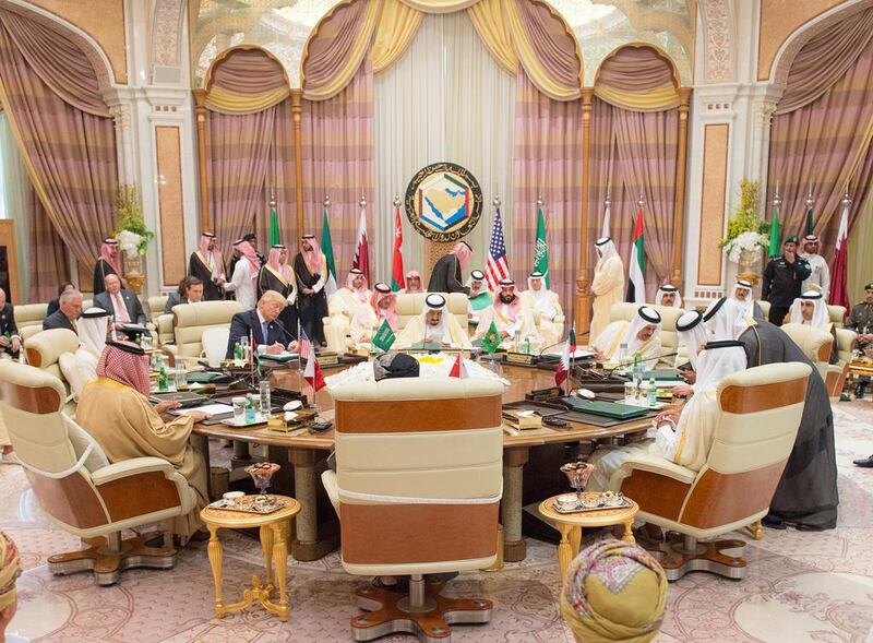 US president Donald Trump sits down to a meeting with GCC leaders, including Saudi Arabia's King Salman bin Abdulaziz Al Saud, during their summit in Riyadh, Saudi Arabia May 21, 2017. Bandar Algaloud / Courtesy Saudi Royal Court via Reuters