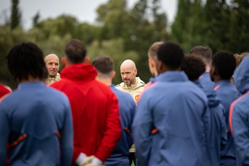 Manager Erik ten Hag talks to his players.