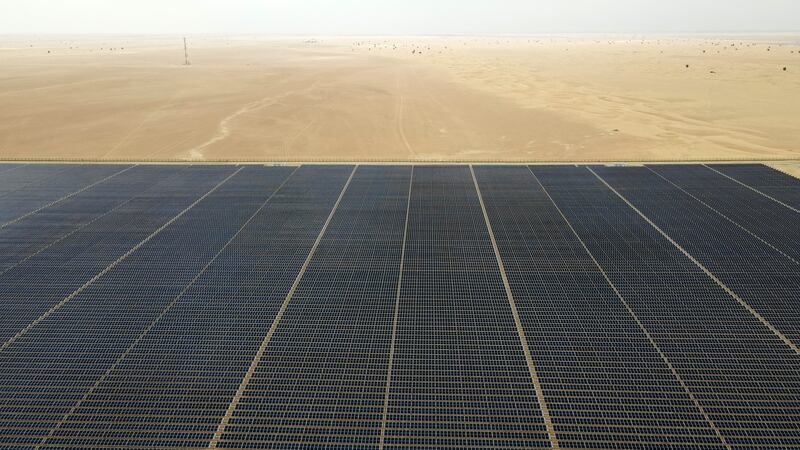 An aerial view of the Mohammed bin Rashid Al Maktoum Solar Park Phase 5 in Dubai. The UAE is developing new renewable energy projects to boost its clean energy capacity.  Pawan Singh / The National