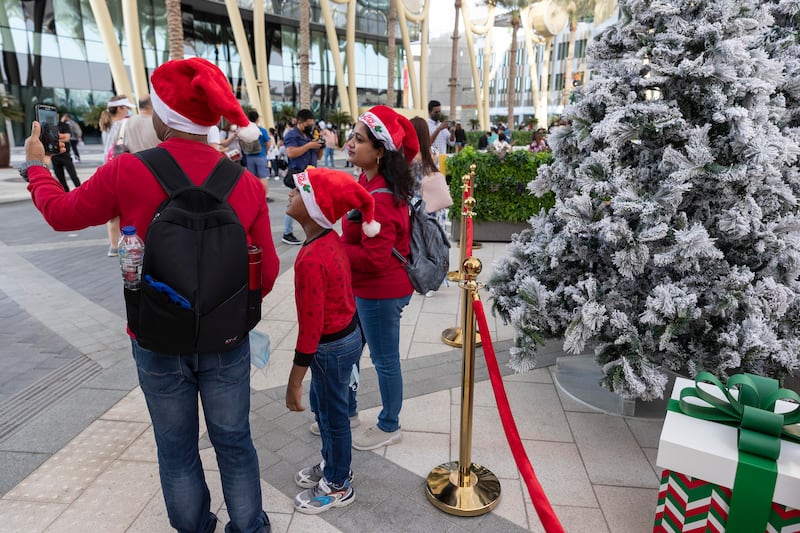 Expo visitors get into the Christmas spirit.