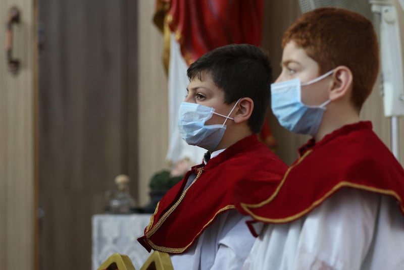 Altar boys take part in a mass at the Mart Shmoni church in Erbil, the capital of the autonomous Kurdish region of northern Iraq. AFP