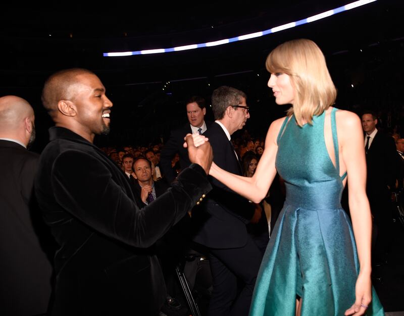 Kanye West and Taylor Swift famously end a decade-long feud at the 2015 Grammys. WireImage