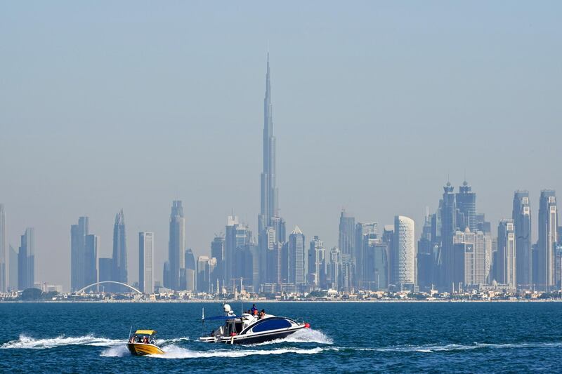 A picture taken on December 25, 2019 shows the skyline of Dubai with Burj Khalifa, the world���s tallest building. (Photo by GIUSEPPE CACACE / AFP)