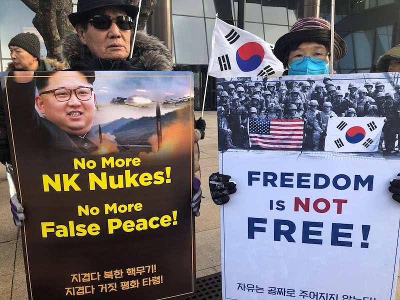 Members of conservative groups shout slogans during a rally against North Korea's nuclear power in downtown in Seoul, South Korea, on January 9, 2018. Jeon Heon-kyun / EPA