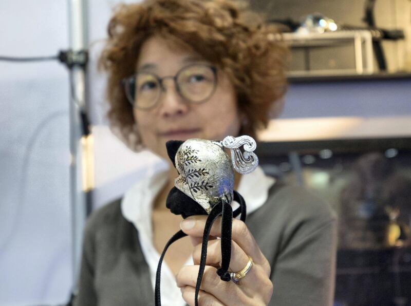 ABU DHABI, UNITED ARAB EMIRATES - Miwako Yangisawa makes jewelries for falcons and other animals at the ADIHEX exhibition at ADNEC Abu Dhabi.  Leslie Pableo for The National for Gillian Duncan’s story