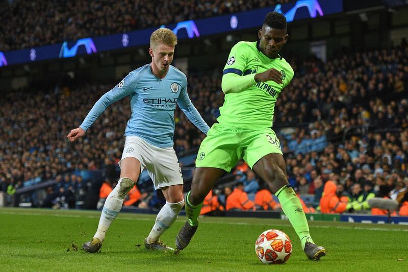 Manchester City's Ukrainian midfielder Oleksandr Zinchenko vies with Schalke's Swiss striker Breel Embolo. AFP