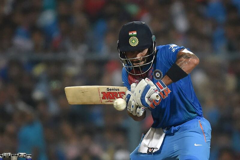 India's Virat Kohli plays a shot at the last moment after having judged for pace and turn from Pakistan's Shahid Afridi at the Eden Gardens, Kolkata. Prakash Singh / AFP