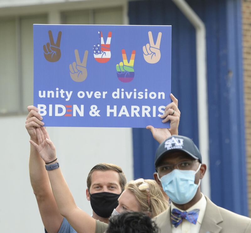 Supporters of Democratic vice presidential nominee, Kamala Harris line the streets on September 28, 2020 in Raleigh, North Carolina. AFP