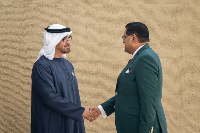 President Sheikh Mohamed greets Chandrikapersad Santokhi, President of Suriname. Eissa Al Hammadi / UAE Presidential Court 